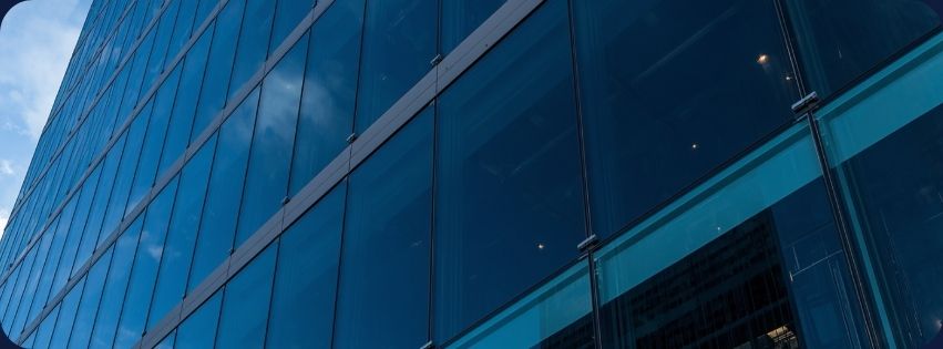 Clear View technician cleaning a commercial storefront window in Qatar